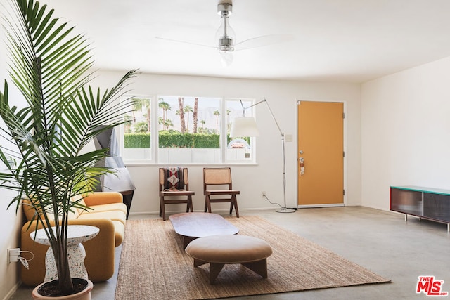 living area featuring ceiling fan