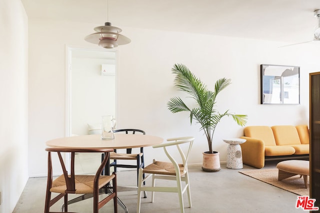 dining space with ceiling fan