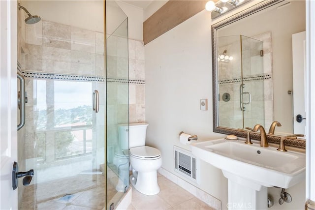 bathroom with sink, tile patterned floors, toilet, and walk in shower