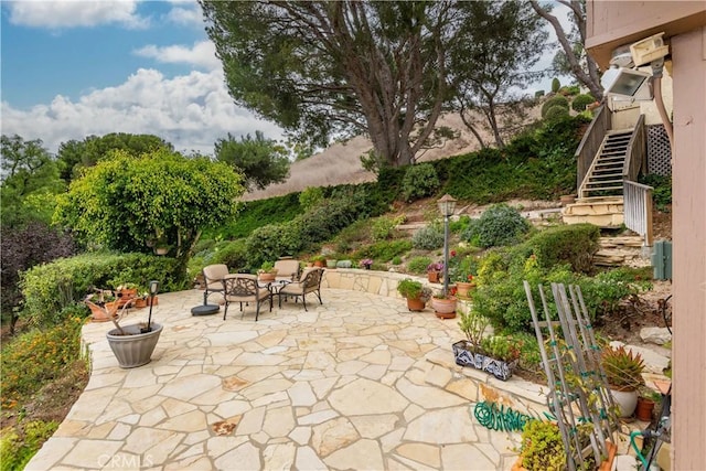 view of patio with a fire pit