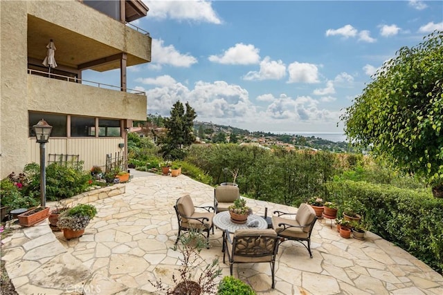 view of patio with a balcony