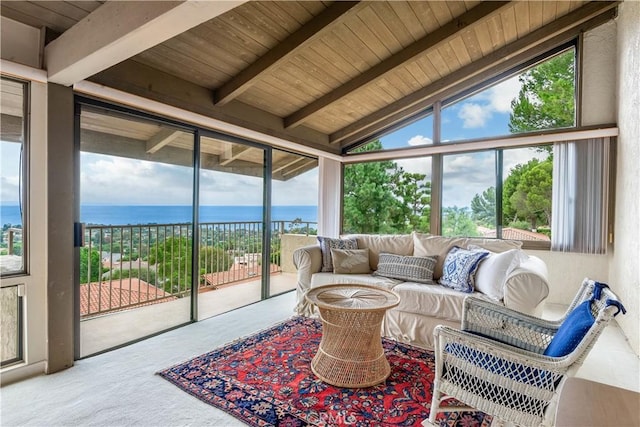 sunroom featuring a water view, vaulted ceiling with beams, and wood ceiling