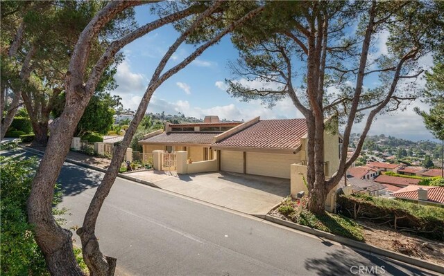 mediterranean / spanish home with a garage