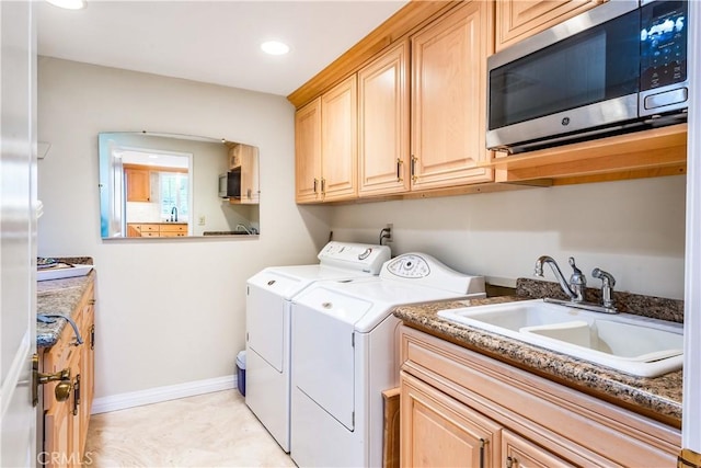 laundry room with sink and washing machine and clothes dryer