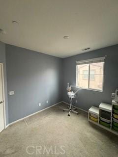 unfurnished room featuring carpet flooring