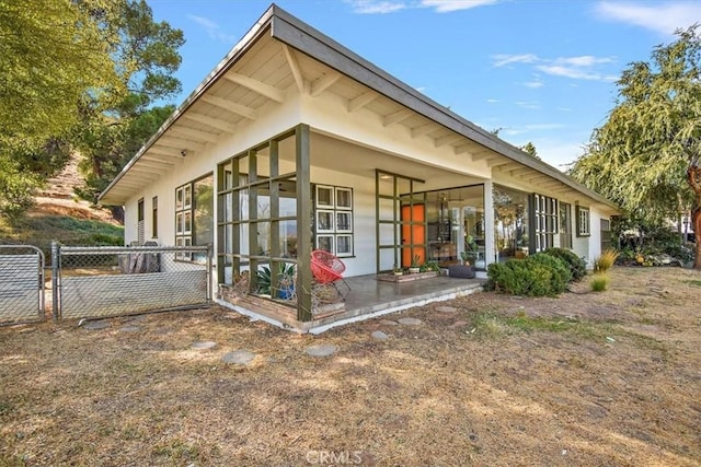 view of side of property featuring a patio area