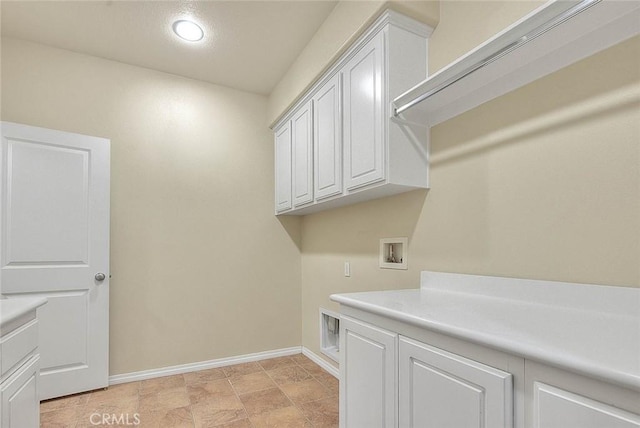 washroom featuring cabinets and washer hookup