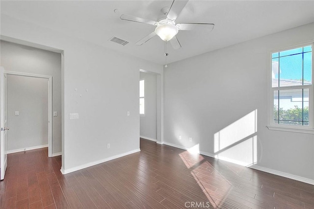 unfurnished room featuring ceiling fan and dark hardwood / wood-style flooring