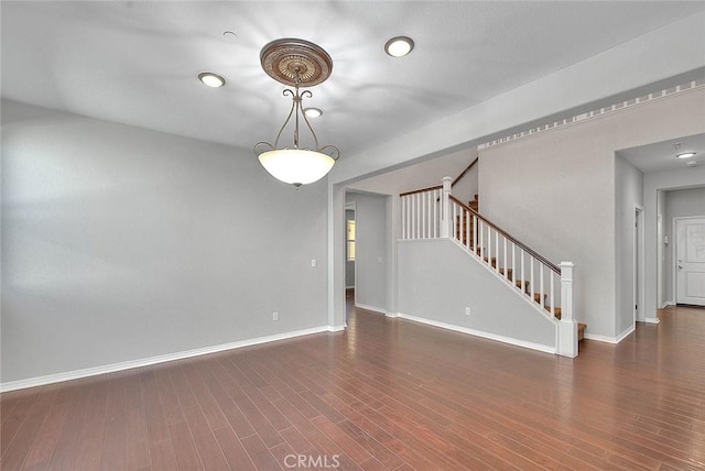 empty room with dark wood-type flooring