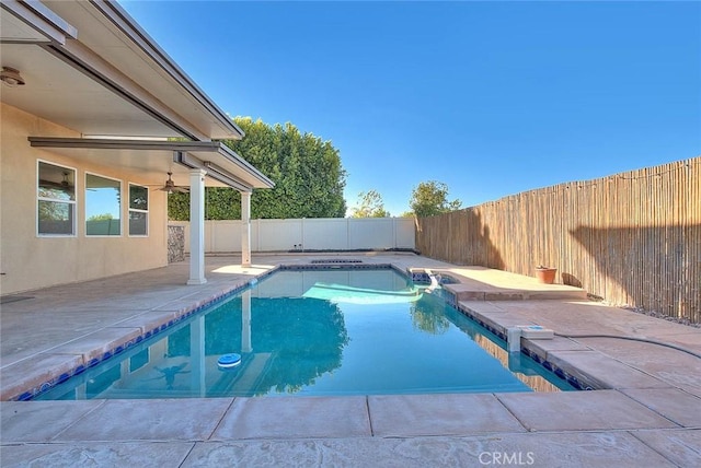 view of pool featuring ceiling fan and a patio