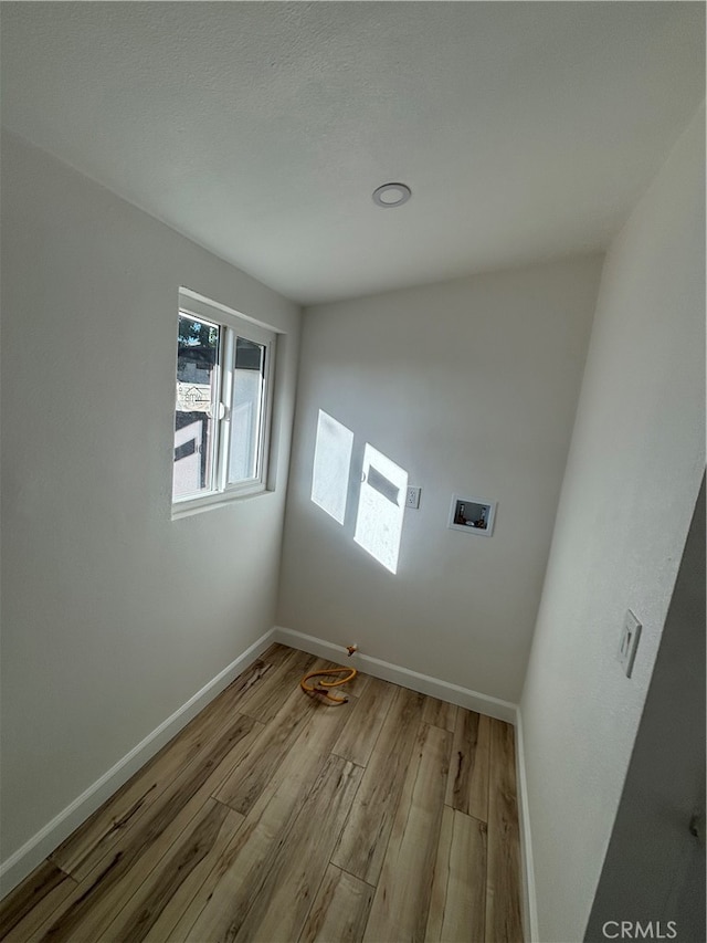 laundry area featuring light hardwood / wood-style flooring and washer hookup