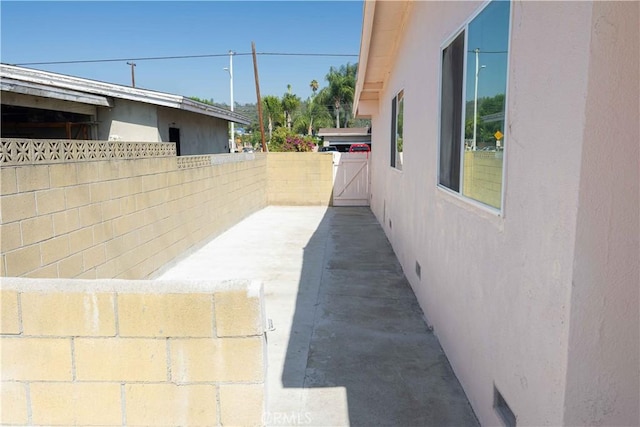 view of property exterior featuring a patio area