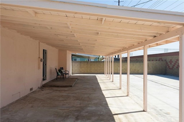 view of patio / terrace featuring a carport