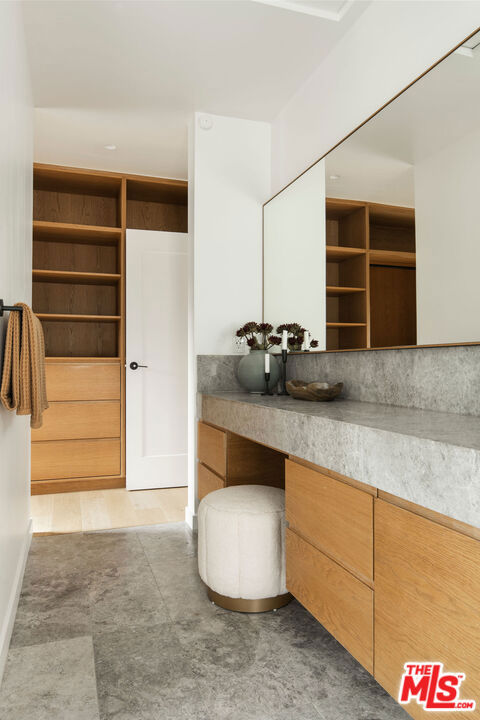 bathroom with decorative backsplash, hardwood / wood-style floors, and vanity