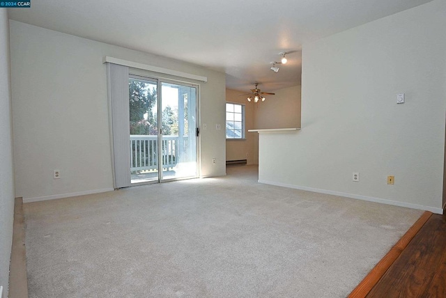 unfurnished room featuring light colored carpet, a baseboard radiator, and ceiling fan