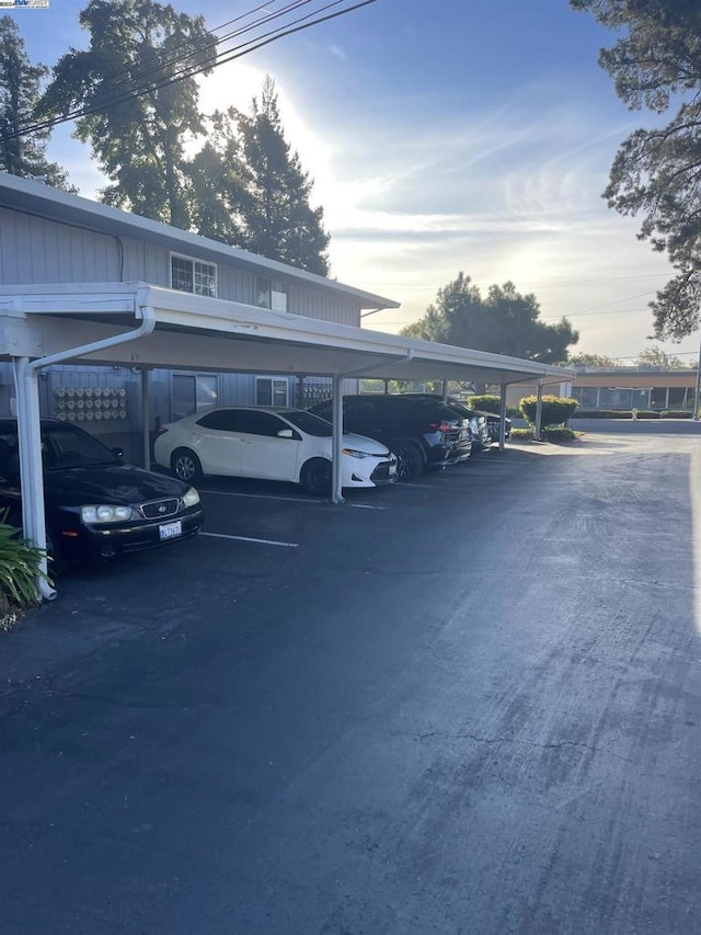 view of parking / parking lot with a carport