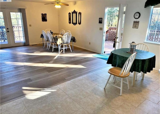 dining area featuring french doors, light wood-type flooring, and ceiling fan