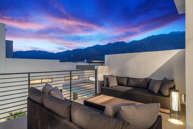 balcony at dusk with a mountain view