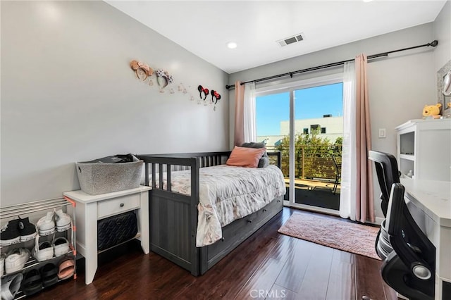 bedroom featuring access to outside and dark hardwood / wood-style floors