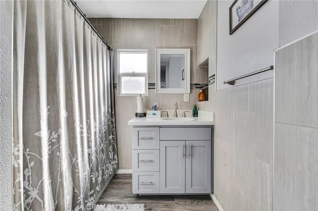 bathroom featuring vanity and hardwood / wood-style floors