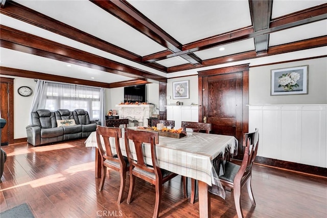 dining space featuring coffered ceiling, beam ceiling, and hardwood / wood-style floors