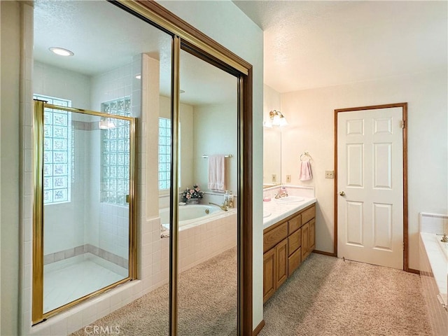 27547 W Shore Rd, Lake Arrowhead, CA 92352 - bathroom with a stall shower, a garden tub, healthy amount of natural light, double vanity, and a textured ceiling