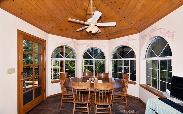 sunroom / solarium featuring ceiling fan, wood ceiling, and vaulted ceiling