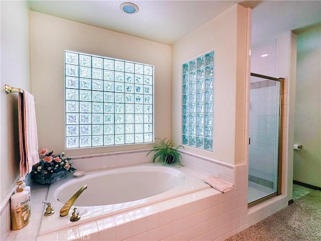 full bath with a bath and a stall shower