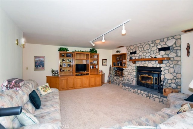 living room with rail lighting and carpet