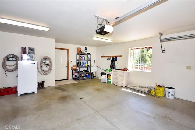 garage featuring refrigerator and a garage door opener