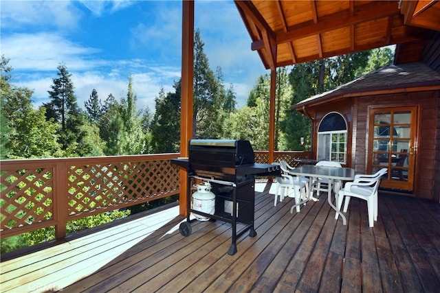 wooden terrace with area for grilling