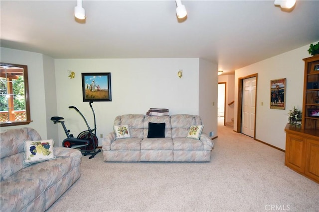 living area with light carpet