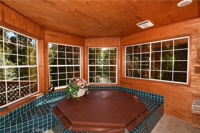 unfurnished sunroom featuring wood ceiling