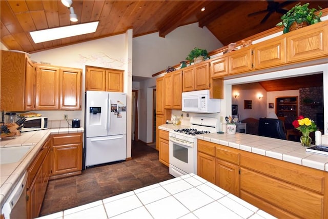 kitchen with tile counters, wood ceiling, white appliances, ceiling fan, and lofted ceiling with beams