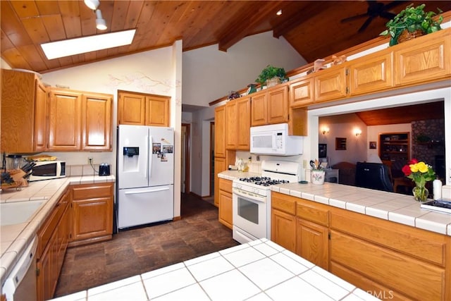 27547 W Shore Rd, Lake Arrowhead, CA 92352 - kitchen featuring white appliances, a skylight, tile countertops, high vaulted ceiling, and wood ceiling with exposed beams