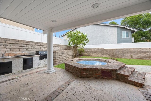 view of patio / terrace featuring sink and a grill