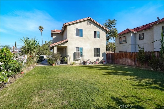 back of house featuring a yard