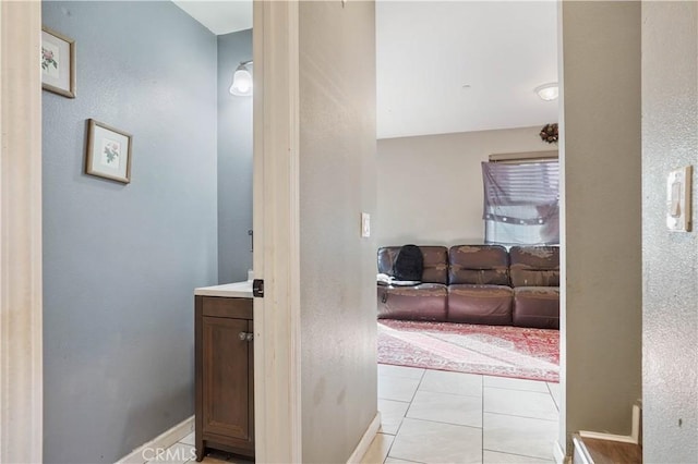 corridor featuring light tile patterned floors