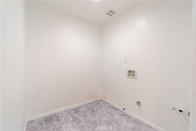 laundry area featuring laundry area, visible vents, baseboards, gas dryer hookup, and washer hookup