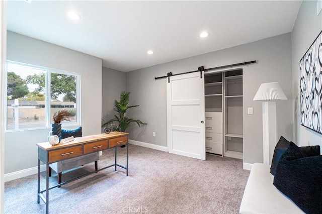 carpeted home office featuring a barn door, recessed lighting, and baseboards