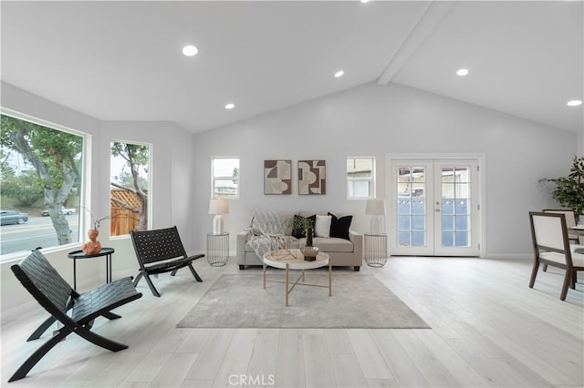 living area with light wood finished floors, french doors, and vaulted ceiling with beams