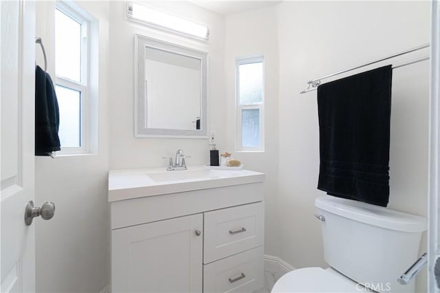 half bath with vanity and toilet