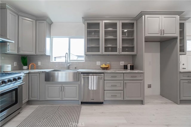 kitchen with appliances with stainless steel finishes and gray cabinets