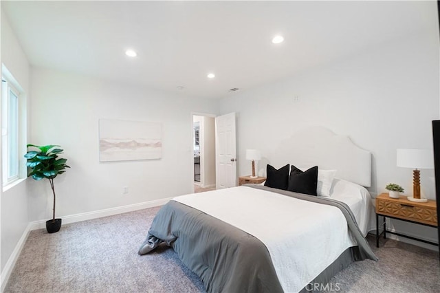 carpeted bedroom featuring baseboards and recessed lighting