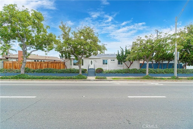 view of front of home with fence