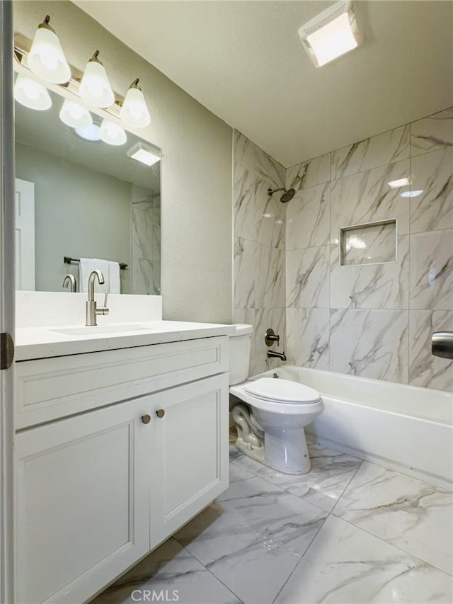 full bathroom with vanity, toilet, and tiled shower / bath combo