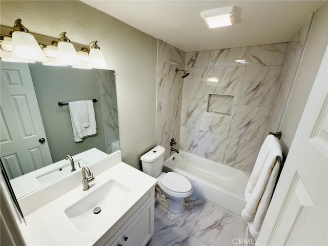 full bathroom with vanity, toilet, and tiled shower / bath