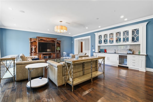 living room featuring wine cooler, dark wood-type flooring, and bar