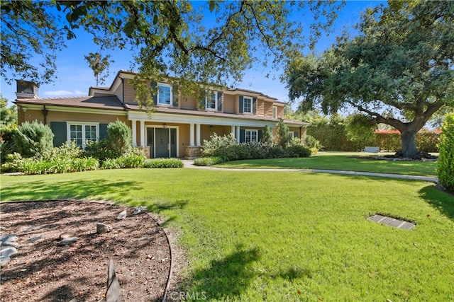 view of front of home with a front yard