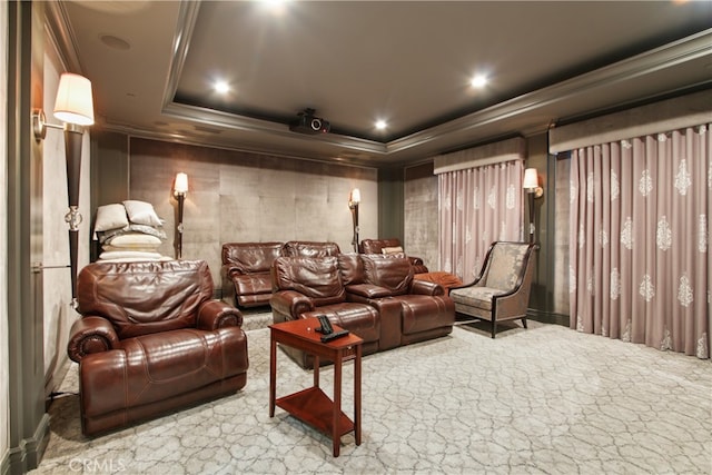 home theater featuring crown molding, carpet flooring, and a tray ceiling